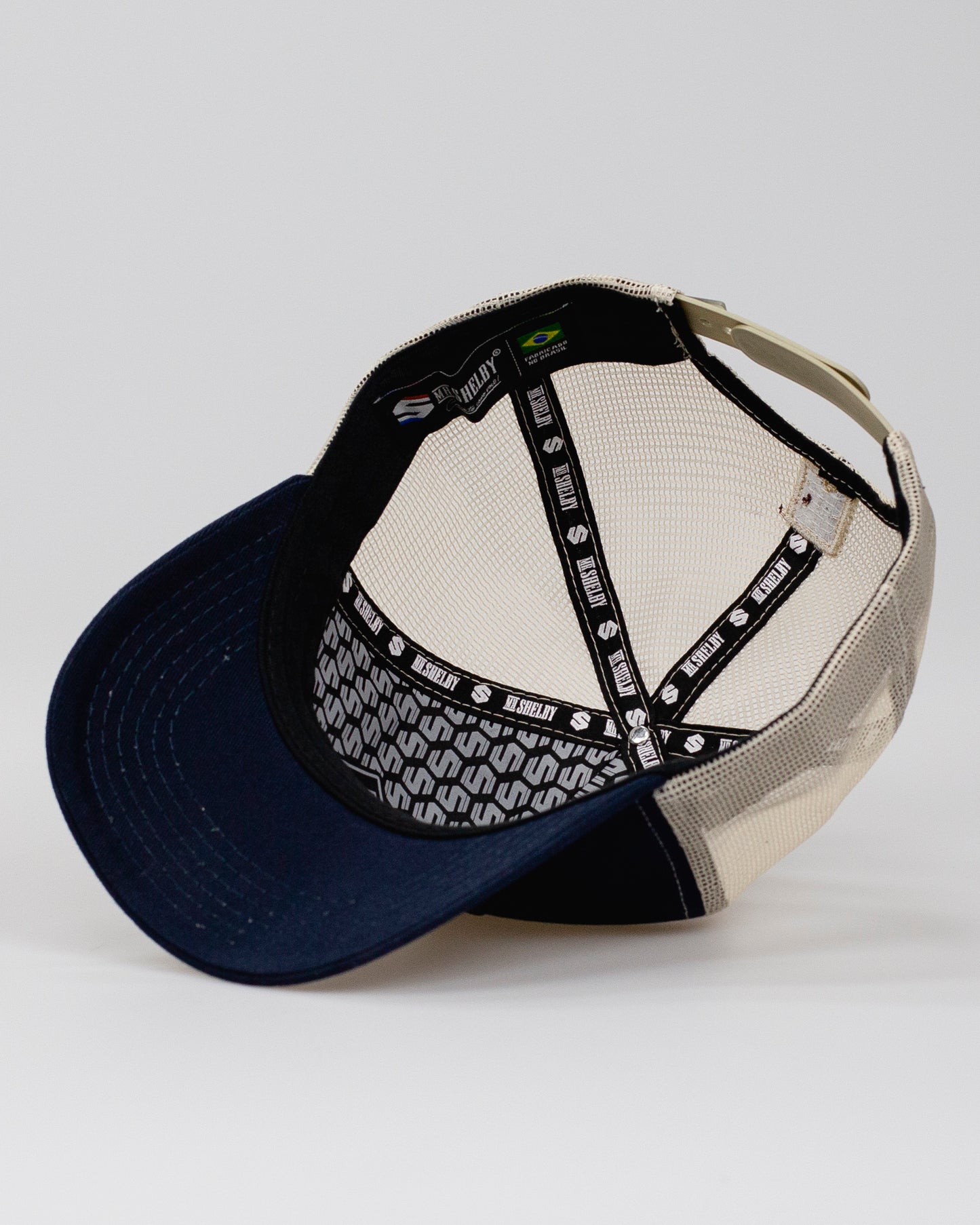 Boné Trucker Mr. Shelby Brasão Marinho e Bege